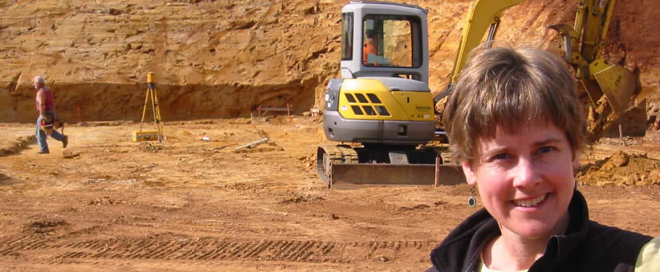 A selfie pf Lynn Penner with construction in the background.