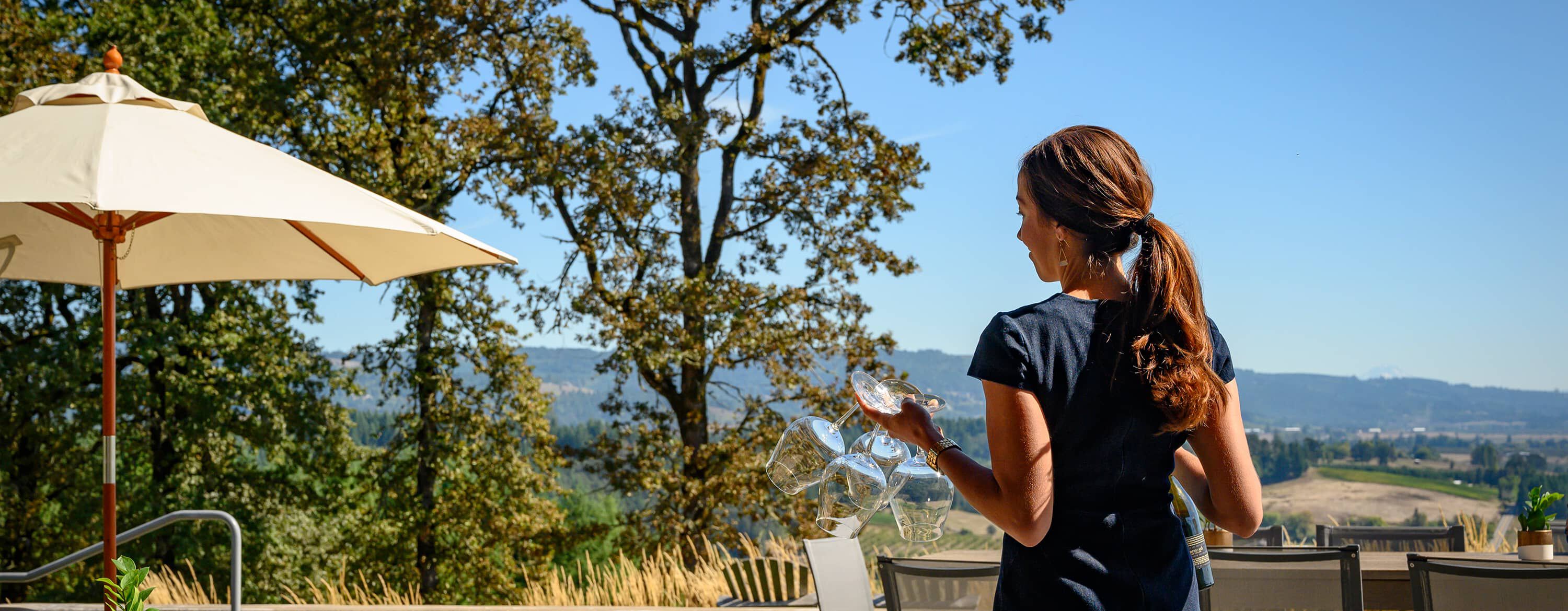 Penner-Ash Estate Manager setting up a tasting experience.